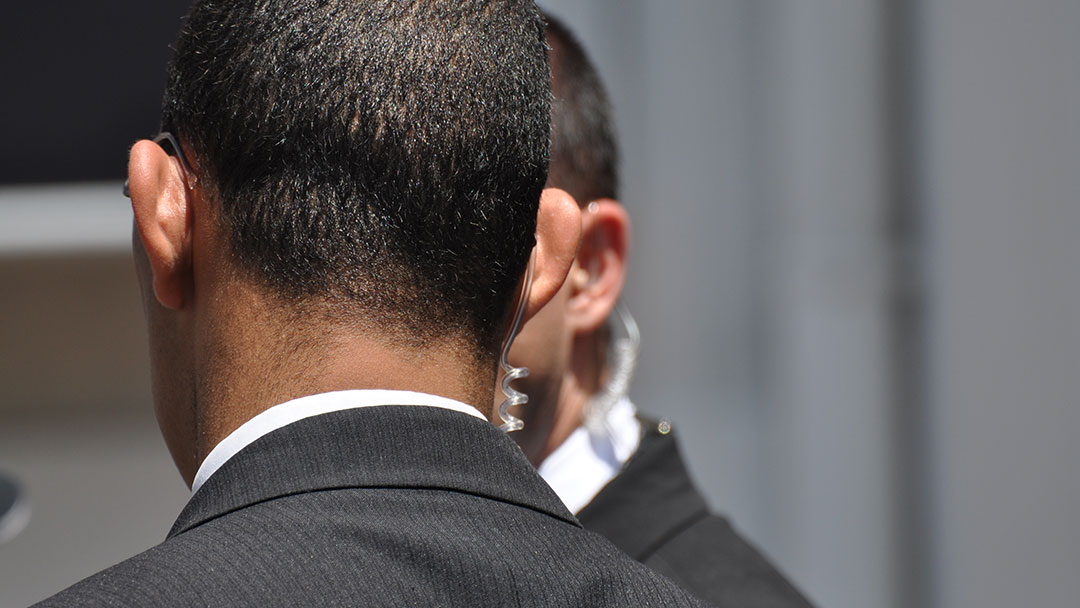 Close up of a close protection security guards