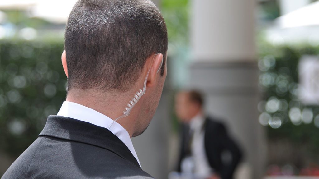 Close up of a close-protection security guard being vigilant