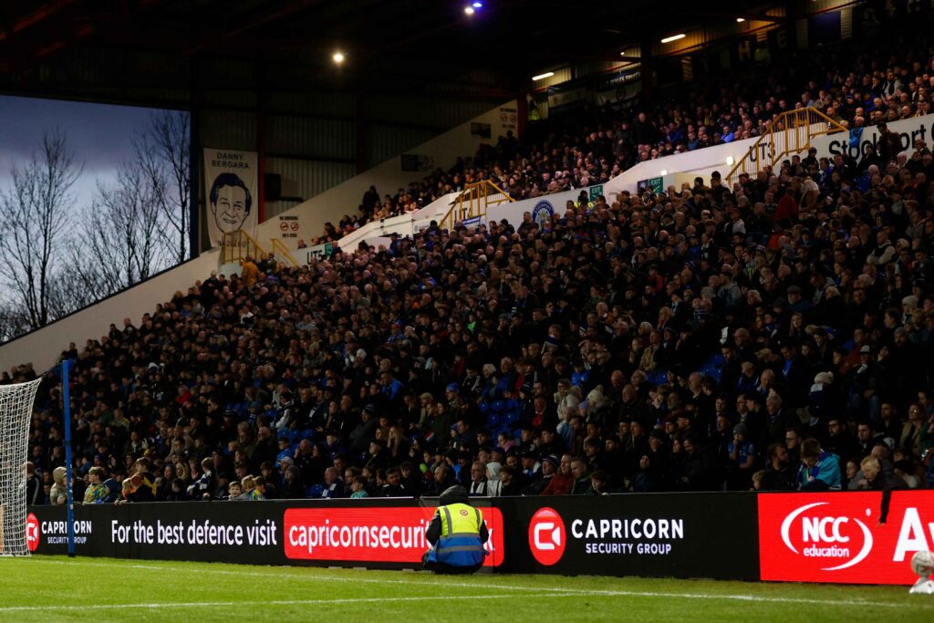 Stockport County Security steward in front of the crowd